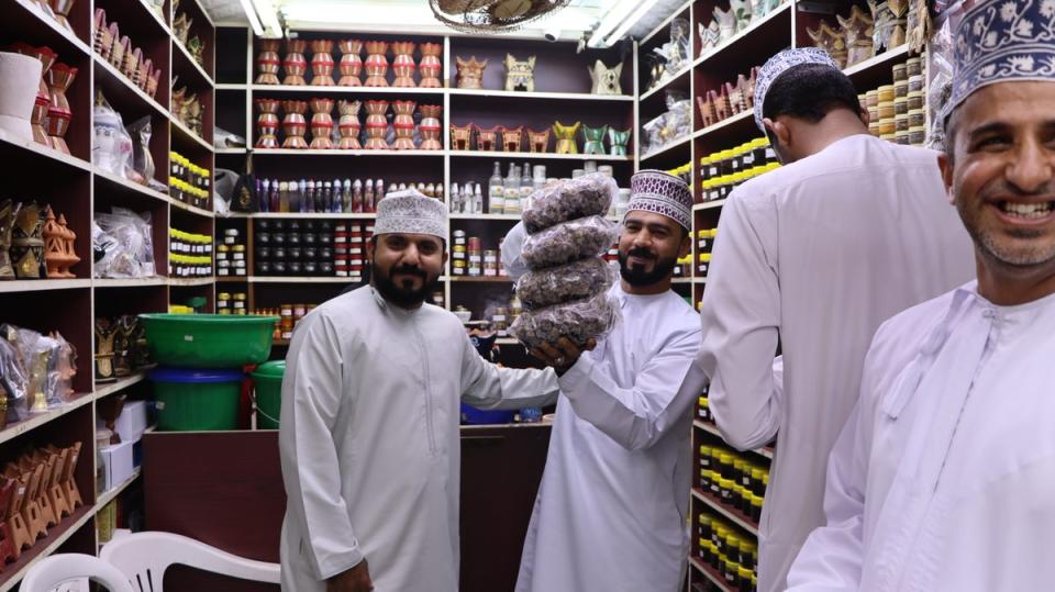 Men showing off bags of Frankincense at market in Salalah (Charline Bou Mansour)