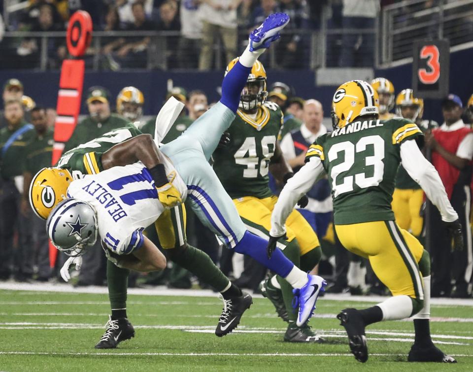 <p>Dallas Cowboys wide receiver Cole Beasley (11) gets tackled by Green Bay Packers defensive back Kentrell Brice (29) in the second quarter in the NFL divisional playoffs on Sunday, Jan. 15, 2017 in AT&T Stadium in Arlington, Texas. (Richard W. Rodriguez/Fort Worth Star-Telegram/TNS via Getty Images) </p>