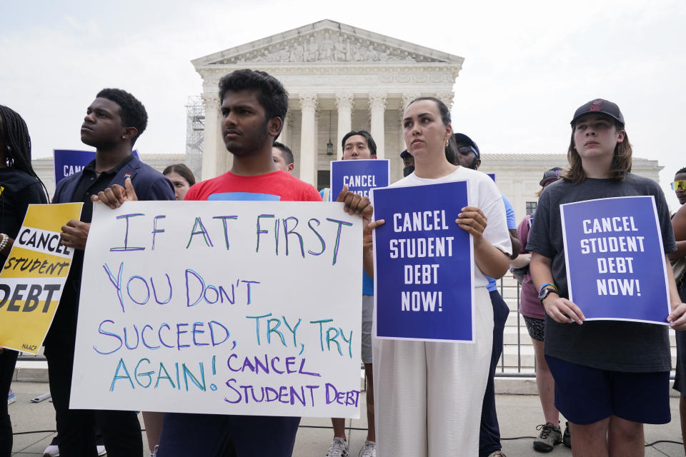 People demonstrate outside the Supreme Court, Friday, June 30, 2023, in Washington. A sharply divided Supreme Court has ruled that the Biden administration overstepped its authority in trying to cancel or reduce student loan debts for millions of Americans. Conservative justices were in the majority in Friday's 6-3 decision that effectively killed the $400 billion plan that President Joe Biden announced last year. (AP Photo/Jacquelyn Martin)