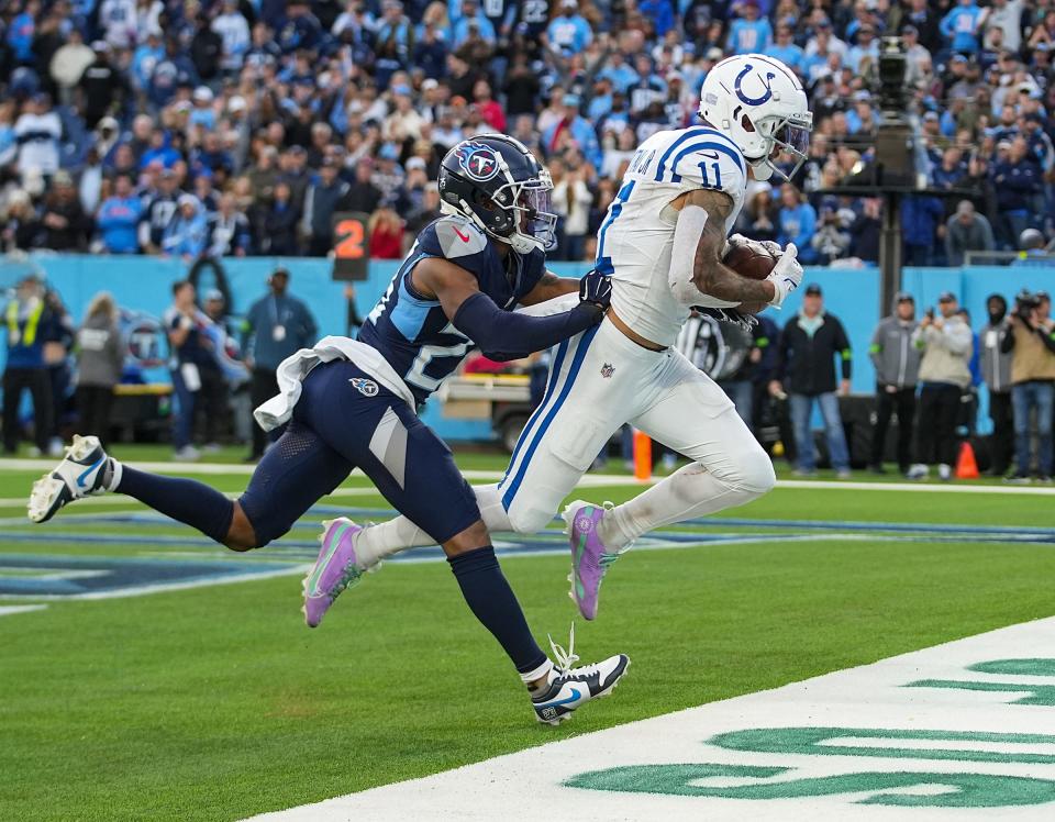 Indianapolis Colts wide receiver Michael Pittman Jr. (11) runs in the game-winning touchdown in overtime against the Tennessee Titans on Sunday, Dec. 3, 2023, at Nissan Stadium in Nashville, Tenn. The final score was 31-28.