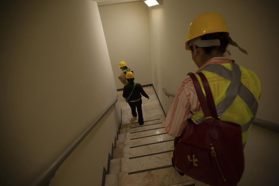 People evacuate a building during a 7.5 earthquake, in Mexico City, Tuesday, June 23, 2020. The earthquake centered near the resort of Huatulco in southern Mexico swayed buildings Tuesday in Mexico City and sent thousands into the streets. (AP Photo/Fernando Llano)