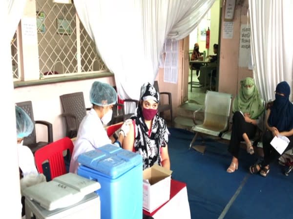 A woman receiving COVID vaccine jab at an innoculation centre in Indore (ANI).