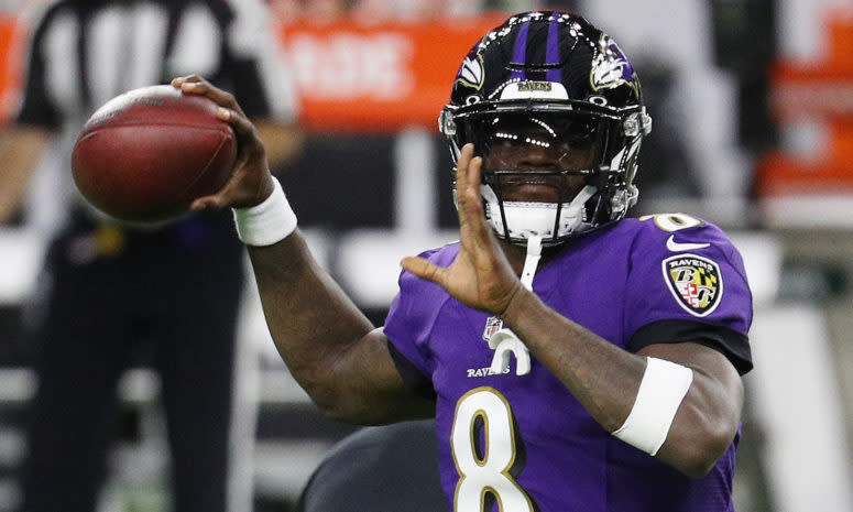 Baltimore Ravens quarterback Lamar Jackson throws a pass.