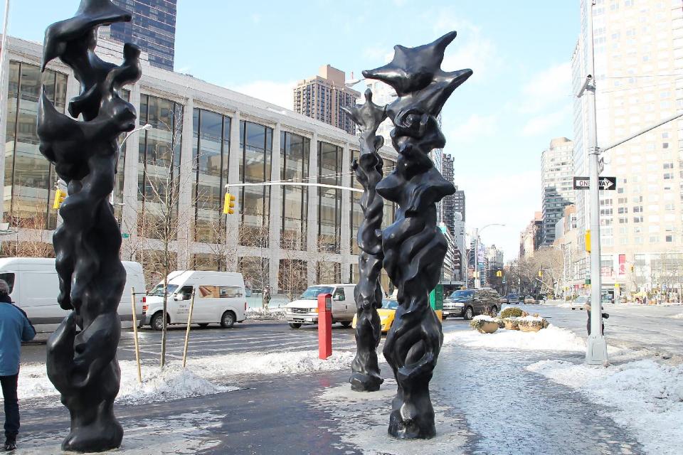 This image released by Starpix shows three black bronze totem sculptures by musician-artist Herb Alpert on display at Dante Park on west 64th Street and Broadway,Thursday, Jan 23, 2014 in New York. The sculptures will be on display until April 15. (AP Photo/Starpix, Dave Allocca)
