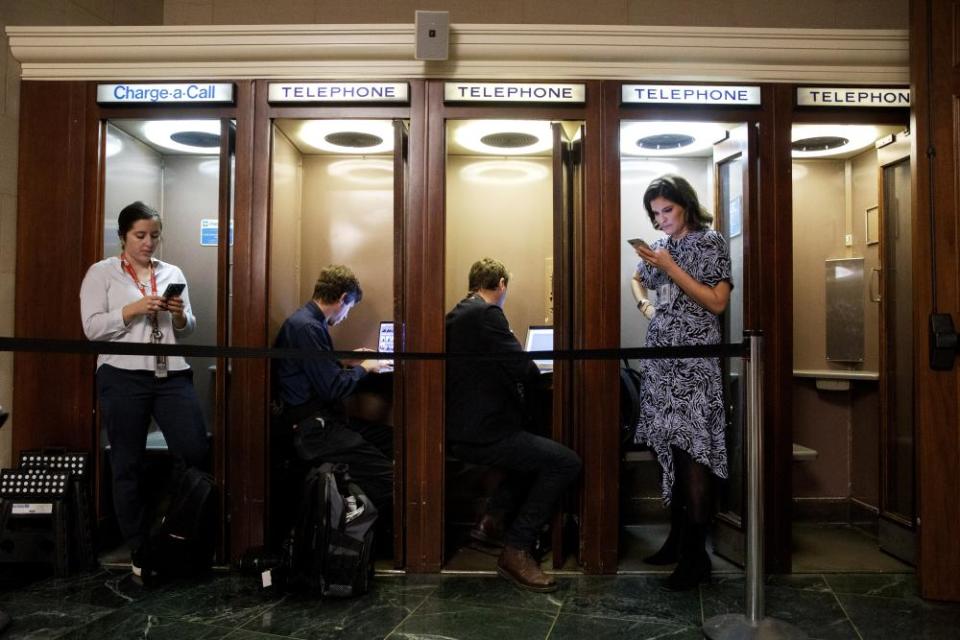 Journalists on Capitol Hill file their copy during the public hearings.