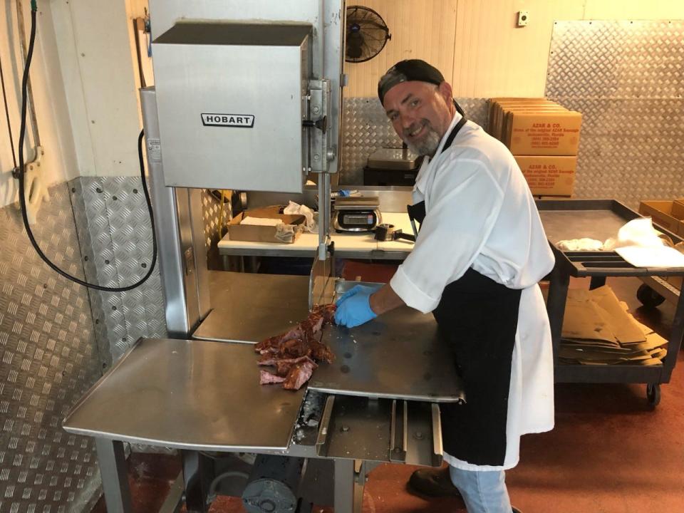 Todd Keeler, a butcher with 25 years of experience, says he enjoys working at Azar & Co. because it's a family-owned small business.