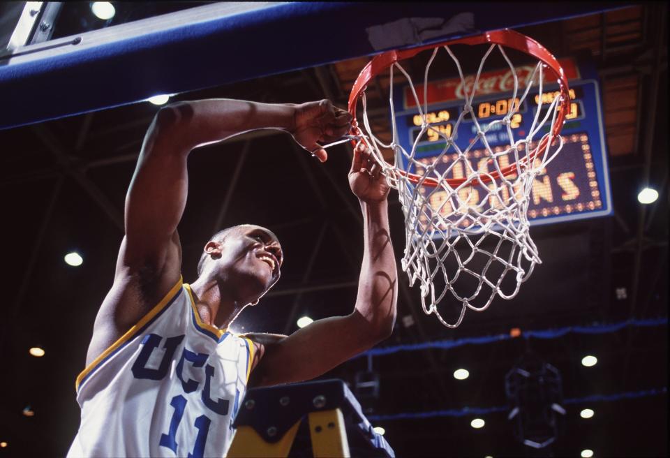 11 Mar 1995: UCLA GUARD TYUS EDNEY CUTS DOWN THE NET IN CELEBRATION OF THE BRUINS'' PAC-10 CHAMPIONSHIP AFTER A VICTORY OVER OREGON STATE AT PAULEY PAVILION IN LOS ANGELES, CALIFORNIA.