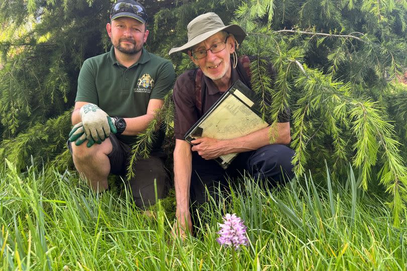 David Brown (left) and Jonathan Shanklin with the protected orchid