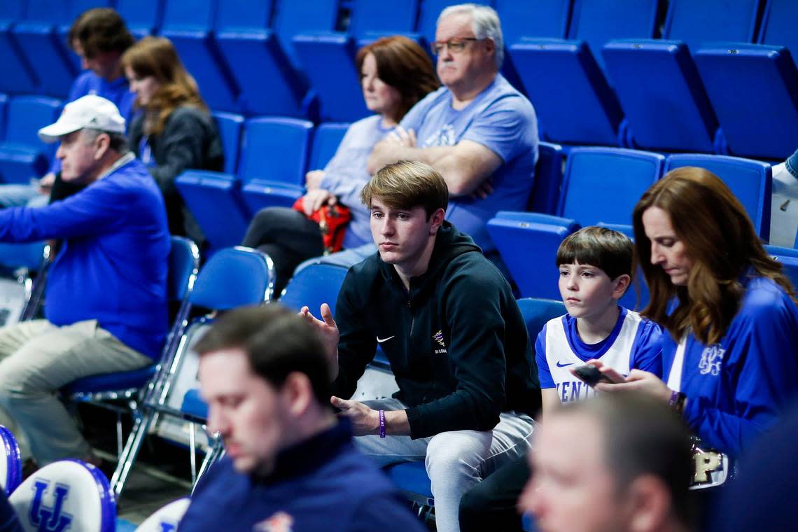 Lyon County basketball star Travis Perry (center) sat courtside while on an unofficial recruiting visit and saw the Kentucky Wildcats pulverize Auburn 86-54 on Feb. 25.