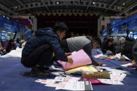 Staff prepare materials for polling booth in New Taipei, Taiwan on Friday, Jan. 12, 2024 ahead of the presidential election on Saturday. (AP Photo/Louise Delmotte)