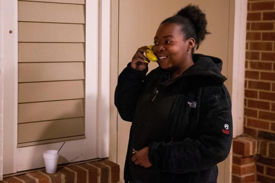 Chanel smiles as she pretends a banana is a phone she’s speaking to Jesus on as she talks about how she plans to get through the day as she prepares to leave Christ the King Lutheran Church after spending the night there through the Room In The Inn program in Memphis, Tenn., on Thursday, November 2, 2023. “Hello?” Chanel said as she raised the banana to her ear. “Yes, Jesus? What are we doing today? He said we’re taking it easy.”