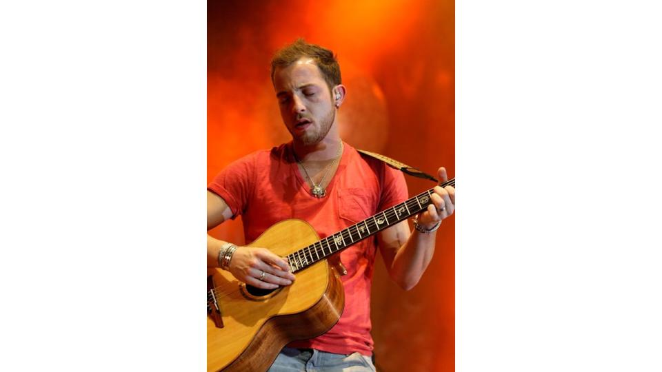 James Morrison performing with a guitar