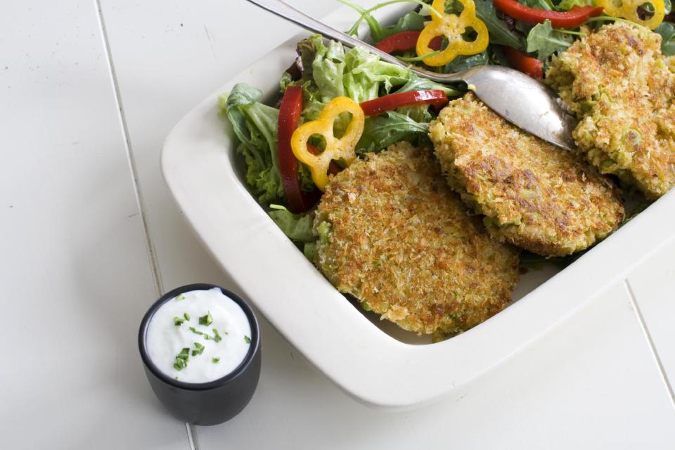 This March 25, 2013 photo taken in Concord, N.H., shows a recipe for Fava Bean Falafel Burger topped with a cucumber yogurt sauce. Falafel are deep-fried fritters made from ground chickpeas or fava beans. (AP Photo/Matthew Mead)