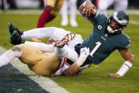 Philadelphia Eagles quarterback Jalen Hurts is sacked by San Francisco 49ers defensive end Nick Bosa during the first half of the NFC Championship NFL football game between the Philadelphia Eagles and the San Francisco 49ers on Sunday, Jan. 29, 2023, in Philadelphia. (AP Photo/Seth Wenig)