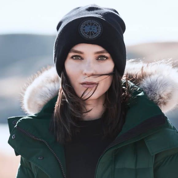 Lady with a Canada Goose hat and coat on.