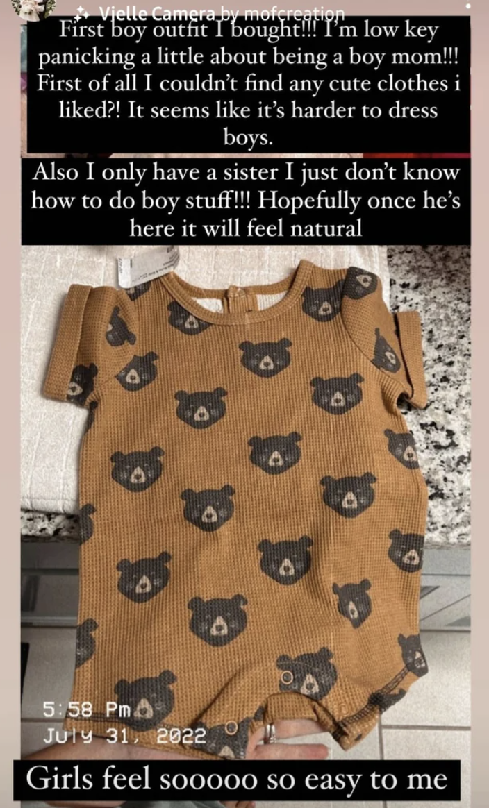 A teddy bear onesie with text: "First boy outfit I bought! I'm low-key panicking about being a boy mom! First of all I couldn't find any clothes I liked?! It seems like it's harder to dress boys"