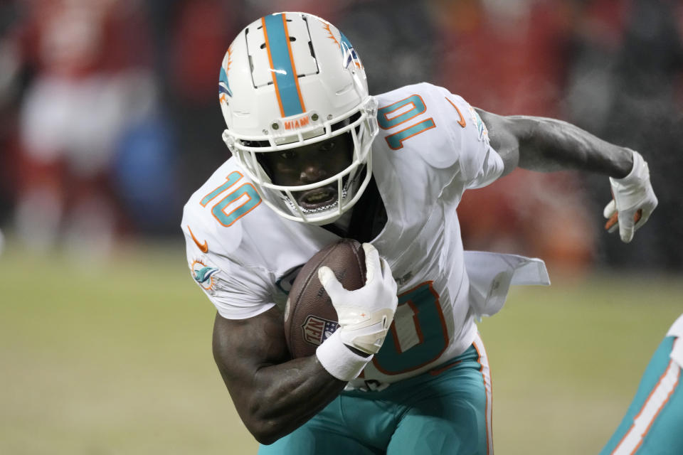 Miami Dolphins wide receiver Tyreek Hill runs for a touchdown against the Kansas City Chiefs during the first half of an NFL wild-card playoff football game Saturday, Jan. 13, 2024, in Kansas City, Mo. (AP Photo/Charlie Riedel)