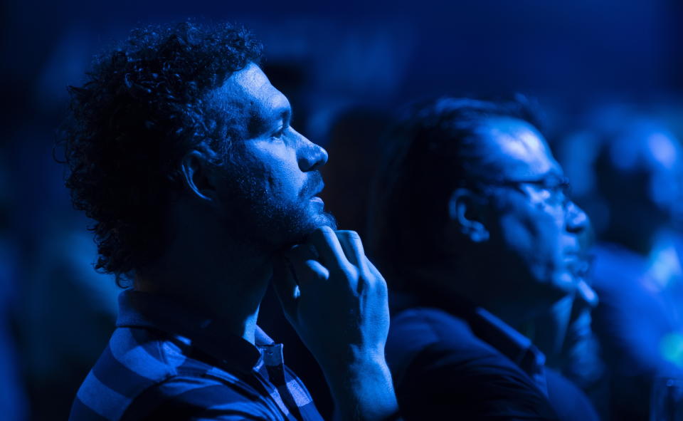 Supporters react as results are shown at the Conservative headquarters in Regina, Saskatchewan, Monday, Oct. 21, 2019. (Adrian Wyld/The Canadian Press via AP)