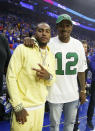 Philadelphia Eagles' DeSean Jackson, left, and Alshon Jeffery, right, look on prior to the first half of Game 3 of a second-round NBA basketball playoff series between the Toronto Raptors and the Philadelphia 76ers, Thursday, May 2, 2019, in Philadelphia. 76ers won 116-95. (AP Photo/Chris Szagola)