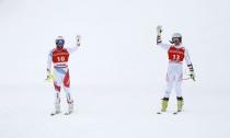 Alpine Skiing - FIS Alpine Skiing World Cup - Men's Alpine Super G - Kitzbuehel, Austria - January 19, 2018. Beat Feuz of Switzerland and Vincent Kriechmayr of Austria. REUTERS/Leonhard Foeger