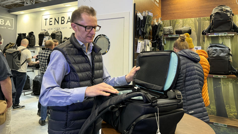 Photo of Niall Hampton handling a 20-litre Shimoda Urban Explore camera pack, in the Anthracite colourway