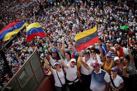 Supporters of Venezuelan opposition leader Juan Guaido, who many nations have recognised as the country's rightful interim ruler, take part in a rally during his visit in Maracaibo, Venezuela, April 13, 2019. REUTERS/Ueslei Marcelino