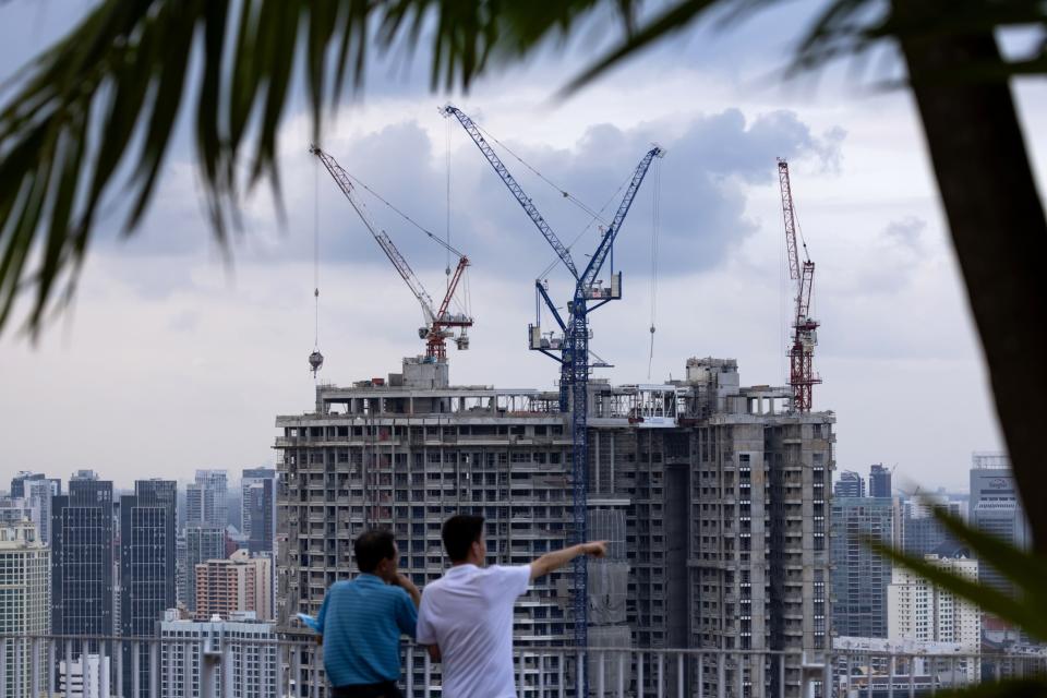 Buildings under construction in Singapore, on Saturday, Feb. 17, 2024. Photographer: SeongJoon Cho/Bloomberg