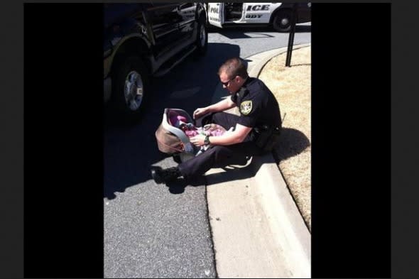 Officer comforting baby