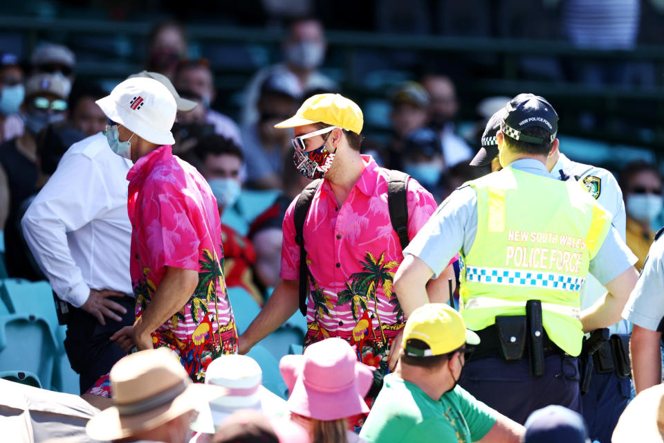 SYDNEY, AUSTRALIA - JANUARY 10: Police speak to spectators following a complaint from Mohammed Siraj of India that stopped play during day four of the Third Test match in the series between Australia and India at Sydney Cricket Ground on January 10, 2021 in Sydney, Australia. (Photo by Cameron Spencer/Getty Images)