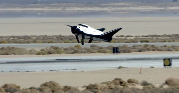 The private Dream Chaser space plane built by Sierra Nevada Corp. is seen landing with its left landing gear not deployed properly in this still from an Oct. 26, 2013 unmanned drop test at Edwards Air Force Base in California. The gear malfunct