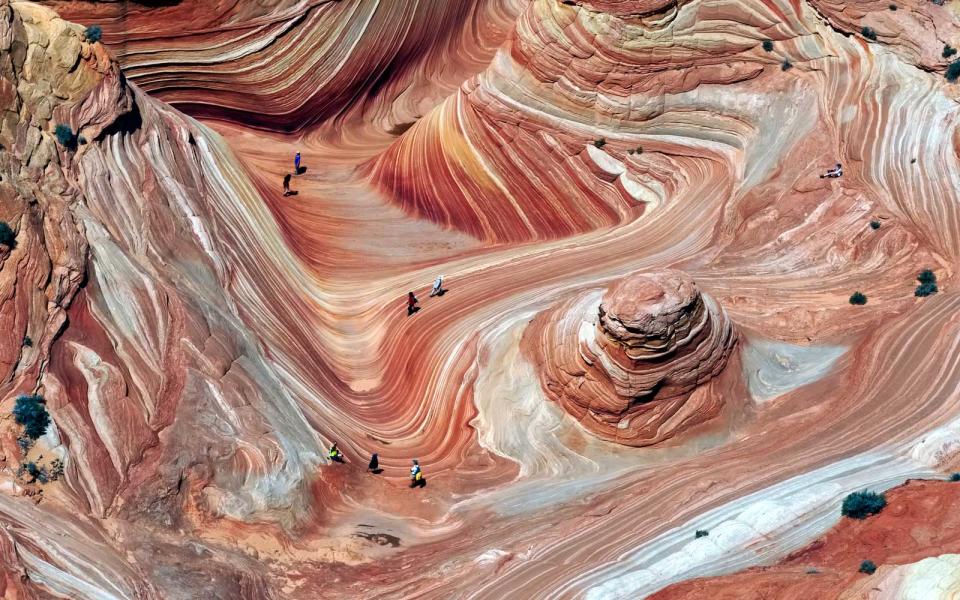 <p>This sandstone formation is brushed in hues of brick red and golden yellow, changing colors as quickly as the weather patterns. Depending on when you visit — sunrise, sunset, the dead of night —you’ll get an entirely different palette.</p>