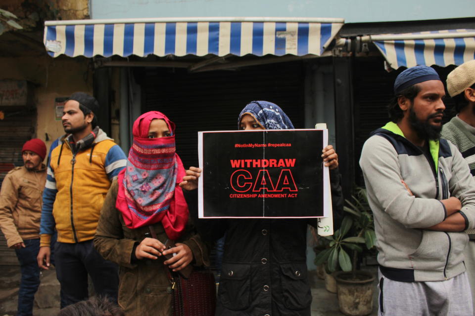 Protesters with posters and placards during a demonstration against the Citizenship Amendment Act (CAA) and National Register of Citizens (NRC) near Red fort on December 19, 2019 in New Delhi, India. Around 1200 protesters including Swaraj India chief Yogendra Yadav and student leader Umar Khalid were detained by Delhi Police during the protest rally at Redfort. The protests have spiked since Sunday following the crackdown and violent police action on students in Jamia Millia Islamia university and Aligarh Muslim University. (Photo by Mayank Makhija/NurPhoto via Getty Images)