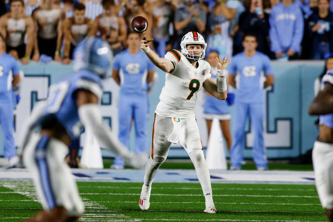 Oct 14, 2023; Chapel Hill, North Carolina, USA; Miami Hurricanes quarterback Tyler Van Dyke (9) passes against the North Carolina Tar Heels in the first half at Kenan Memorial Stadium. Mandatory Credit: Nell Redmond-USA TODAY Sports