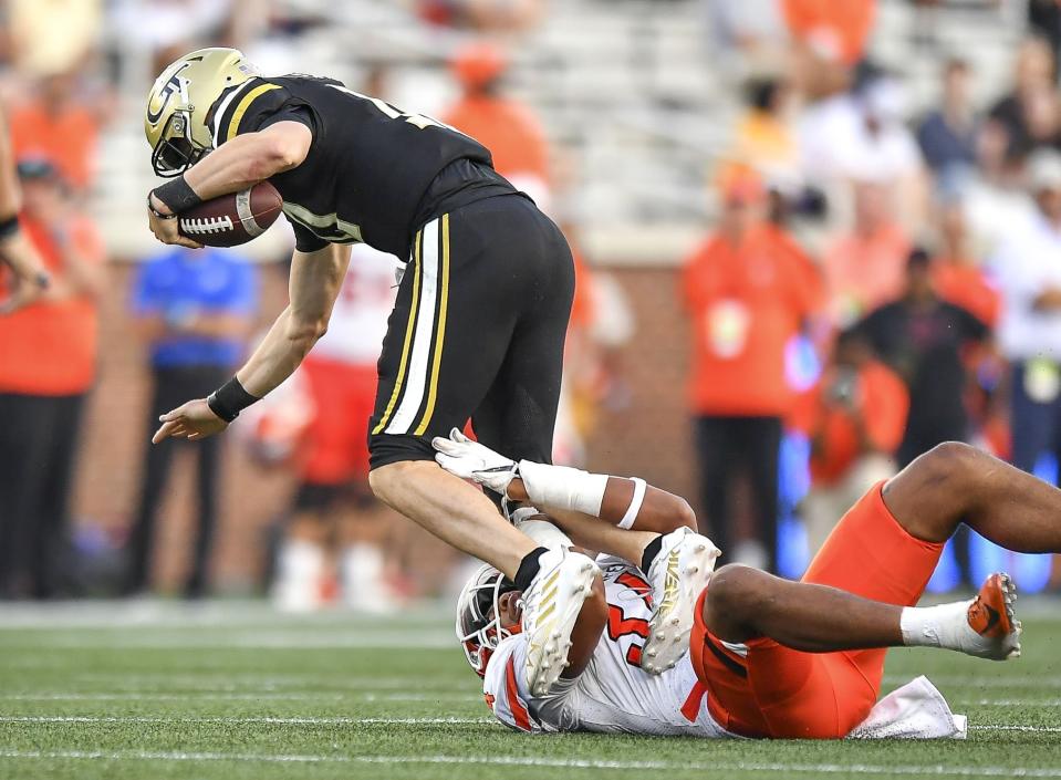 Bowling Green defensive lineman Adrian Wilson (34) sacks Georgia Tech quarterback Haynes King (10) during the second half of an NCAA college football game, in Atlanta, Saturday, Sept. 30, 2023. (Daniel Varnado/Atlanta Journal-Constitution via AP)