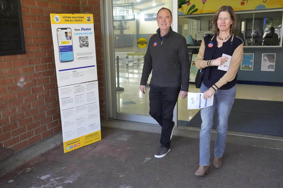 Rep. Adam Schiff, D-Calif., left, walks out of a polling place with his wife Eve after voting, Tuesday, March 5, 2024, in Burbank, Calif. Schiff is running for U.S. Senate to replace the late Sen. Dianne Feinstein. (AP Photo/Marcio Jose Sanchez)