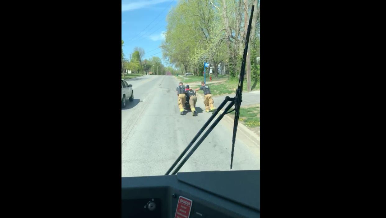 Three firemen in Missouri pushed home a disabled veteran in 80-degree weather when his wheelchair malfunctioned. (Screenshot: Facebook/Raytown Fire Protection District)