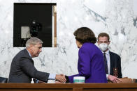 Sen. Lindsey Graham, R-S.C., shakes hands with Sen. Dianne Feinstein, D-Calif., following the fourth day of a confirmation hearing for Supreme Court nominee Amy Coney Barrett, before the Senate Judiciary Committee, Thursday, Oct. 15, 2020, on Capitol Hill in Washington. (Anna Moneymaker/The New York Times via AP, Pool)