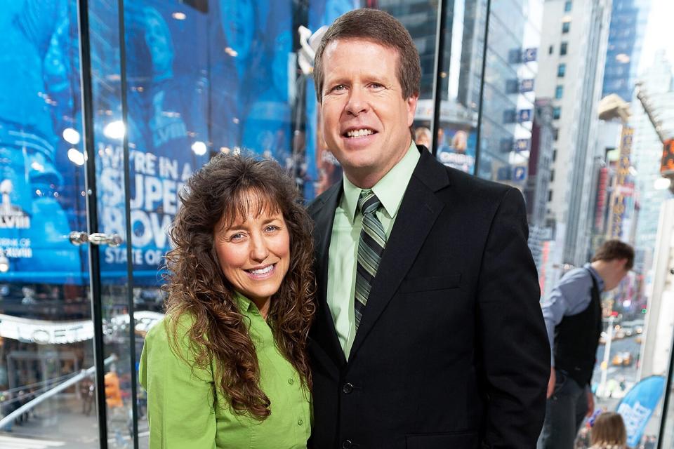 Jim Bob Duggar (R) and wife Michelle Duggar visit "Extra" at their New York studios at H&amp;M in Times Square on March 11, 2014 in New York City.