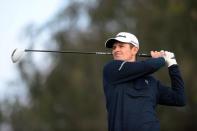 Feb 5, 2015; La Jolla, CA, USA; Justin Rose tees off on the 12th during the first round of the Farmers Insurance Open golf tournament at Torrey Pines Municipal Golf Course - South Course. Mandatory Credit: Jake Roth