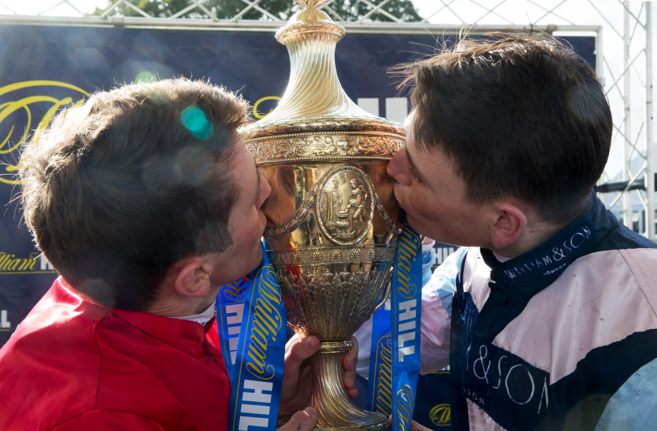 Winning jockeys Chris Hayes (left) and Cameron Noble celebrate with the Ayr Gold Cup