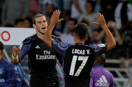 Football Soccer - Spanish Liga Santander - Real Sociedad v Real Madrid - Anoeta, San Sebastian, Spain 21/08/16. Real Madrid's Gareth Bale (L) and Lucas Vazquez celebrate a goal. REUTERS/Vincent West