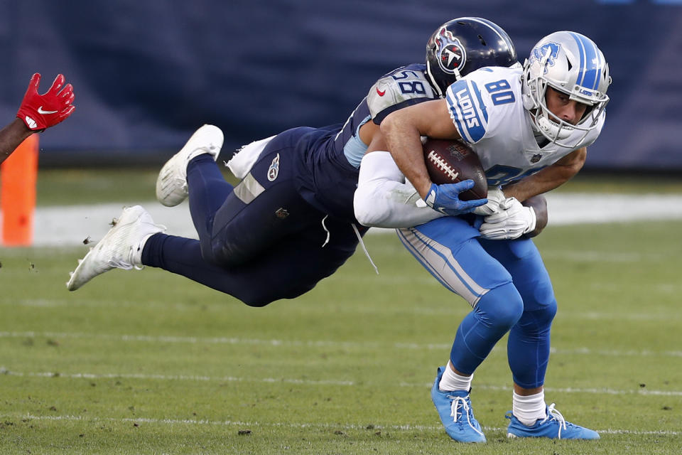 Detroit Lions wide receiver Danny Amendola is tackled by Tennessee Titans outside linebacker Harold Landry during the second half of an NFL football game Sunday, Dec. 20, 2020, in Nashville, N.C. (AP Photo/Wade Payne)