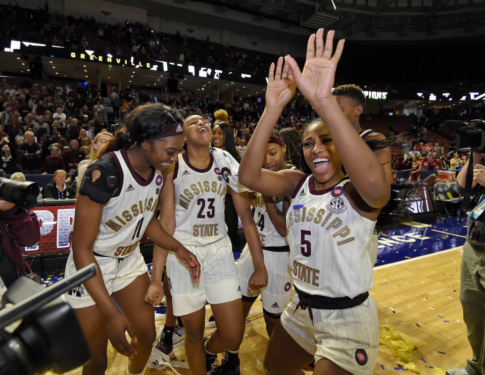 Mississippi State's Anriel Howard (5) along with her teammates celebrate after winning an NCAA college basketball championship game 101-70 against Arkansas in the Southeastern Conference women's tournament, Sunday, March 10, 2019, in Greenville, S.C. (AP Photo/Richard Shiro)