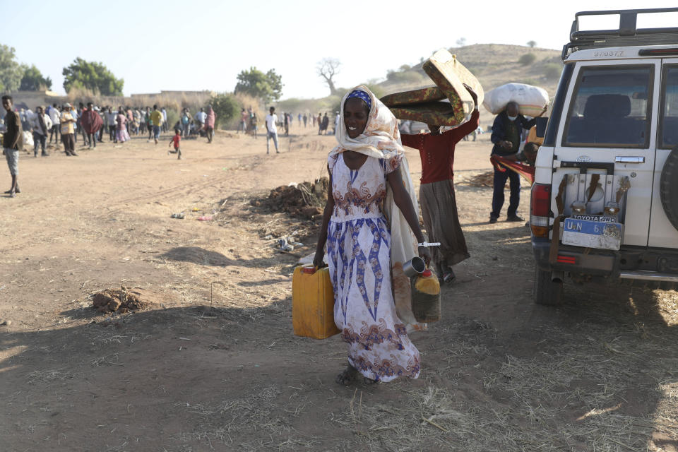 Ethiopian refugees gathert in Qadarif region, easter Sudan, Friday, Nov 20, 2020. Thousands of Ethiopians fled the war in Tigray region into Sudan. (AP Photo/Marwan Ali)