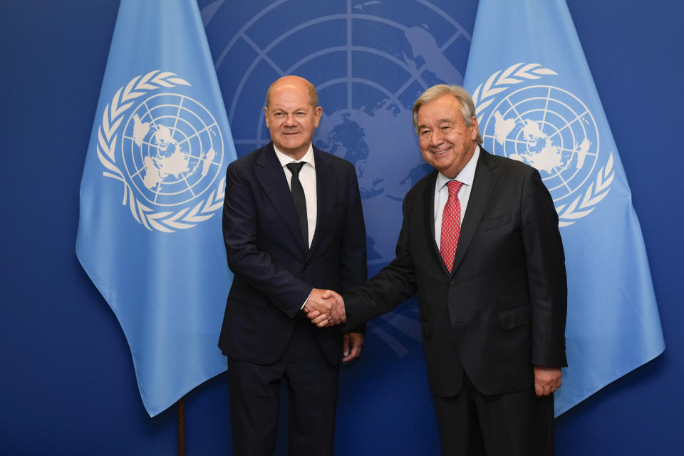 German Chancellor Olaf Scholz, left, poses for a picture with United Nations Secretary-General Antonio Guterres at United Nations headquarters, Monday, Sept. 18, 2023. (AP Photo/Seth Wenig)