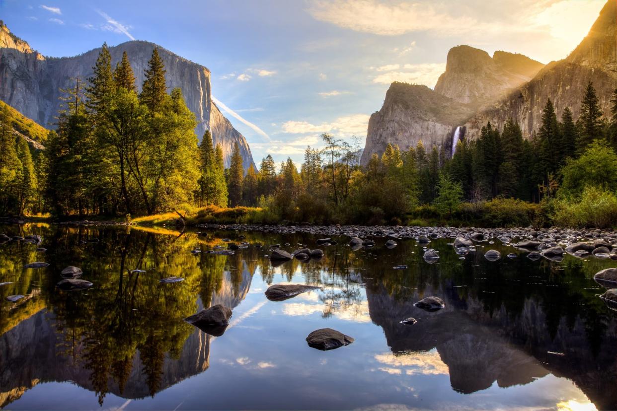 Sunrise on Yosemite Valley reflecting in the water at Yosemite National Park, California