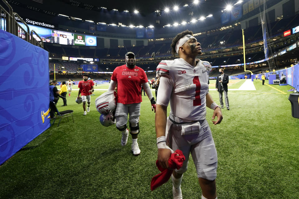 Ohio State quarterback Justin Fields leaves the field after the team's win against Clemson in the Sugar Bowl NCAA college football game Friday, Jan. 1, 2021, in New Orleans. Ohio State won 49-28. (AP Photo/Gerald Herbert)