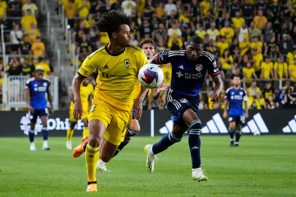 Aug 20, 2023; Columbus, Ohio, USA; Columbus Crew forward Jacen Russell-Rowe (19) races up the sideline past FC Cincinnati defender Ray Gaddis (28) during the second half of the MLS soccer match at Lower.com Field. The Crew won 3-0.