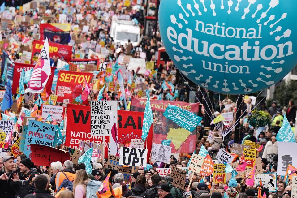 Striking members of the National Education Union (NEU) on Piccadilly march to a rally in Trafalgar Square, central London, in a long-running dispute over pay. Picture date: Wednesday March 15, 2023. (PA Media)