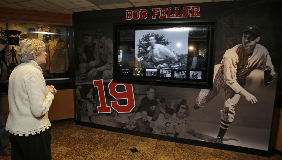 Anne Feller, widow of Bob Feller, watches a video featuring her husband Wednesday, May 13, 2015, in Cleveland. The exhibit features many items from Feller’s playing and Navy careers from the former Bob Feller Museum in Van Meter, Iowa. (AP Photo/Tony Dejak)